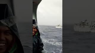 Fishing vessel crew change in rough sea [upl. by Aylsworth]