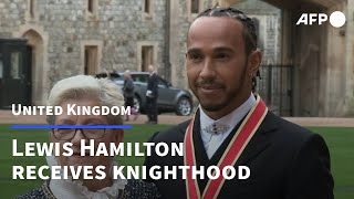 F1 driver Lewis Hamilton receives knighthood at Windsor Castle  AFP [upl. by Hazlett711]