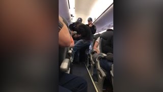 Video shows a passenger forcibly dragged off a United Airlines plane [upl. by Gerta]