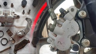 How To Repair Jammed Disc Brake Pistons Of Motorcycle [upl. by Rowe]