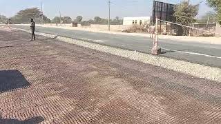 Geogrid installation over GSB for strengthening of pavement [upl. by Lashoh238]