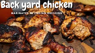 Grilled chicken marinated in Italian salad dressing  backyard style in a Weber kettle grill [upl. by Aihseit]