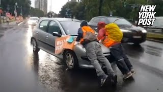 Irate drivers ram into climate protesters blocking traffic drag them hundreds of feet down highway [upl. by Benia]