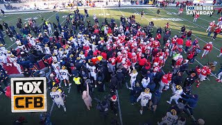 Massive SCUFFLE ensues after Michigan tries to plant flag on Ohio States logo [upl. by Dimitri]