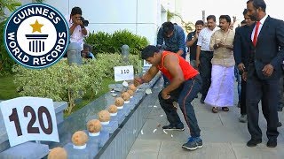 Most coconuts smashed in a minute  Guinness World Records [upl. by Julietta402]