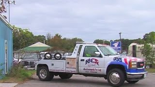 Drivers file lawsuit against towing company [upl. by Llennej]