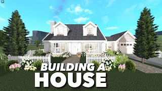 BUILDING A HOUSE IN BLOXBURG IN MY BLOXBURG TOWN [upl. by Anyah203]