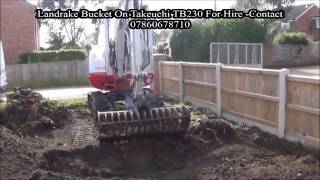 Landrake Bucket on Takeuchi TB230 Sorting Ground and Levelling Soil [upl. by Ganny227]