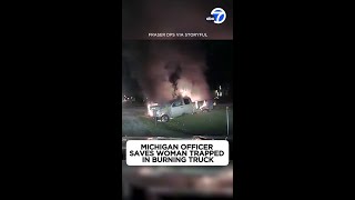 Michigan officer saves woman trapped in burning truck [upl. by Attenal20]