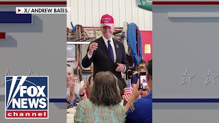 Biden sports Trump 2024 hat in spirit of unity [upl. by Assek]