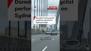 Daredevil motorcyclist performs wheelie on Sydneys Anzac Bridge [upl. by Mada602]