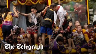 Millions of Filipinos swarm statue of Jesus for Black Nazarene procession [upl. by Ettenotna649]