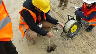 Measuring groundwater level in an open observation hole [upl. by Duwalt]