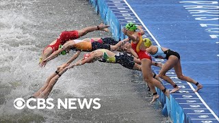 Olympic triathletes swim in Seine after water quality delay [upl. by Sylera]