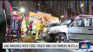 Car smashes into food truck and customers in downtown LA [upl. by Ayalahs617]