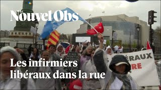 Les infirmiers libéraux en colère manifestent dans les rues de Paris [upl. by Mikihisa127]