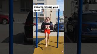 Decompressing your spine by hanging on a pullup bar [upl. by Nyllewell]