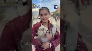 Palestinian girl in Gaza rescues her cat from “Israeli” shelling [upl. by Daven766]