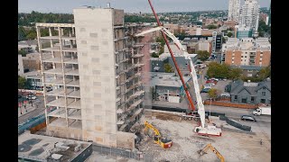 Watch High Reach Demolition in Calgary with Canadas Biggest Excavator the Kobelco 1600 [upl. by Aihseyk]