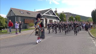 Ellon amp District Pipe Band marching through village to the 2023 Braemar Gathering in Scotland [upl. by Odrick]