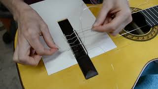 Changing Strings  12 hole bridge classical guitar [upl. by Annairol]