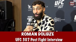 Roman Dolidze reacts to backstage alteration with Kevin Holland following injury win at UFC 307 [upl. by Aria890]