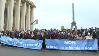 Des milliers de manifestants rassemblés à Paris contre la loi immigration  AFP Images [upl. by Bazar560]