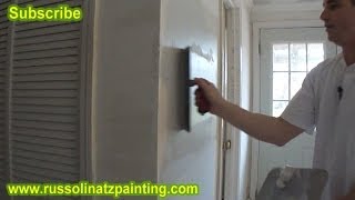 Skim Coating a Small Wall using a 12 inch Marshaltown Trowel [upl. by Bertold]