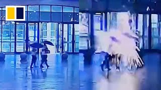 Pedestrians escape death after being struck by lightning in China [upl. by Rehoptsirhc]