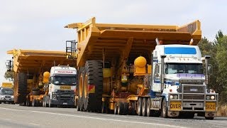 Tri Drive Mack Titan with a Caterpillar 785C dump truck [upl. by Rednasyl]