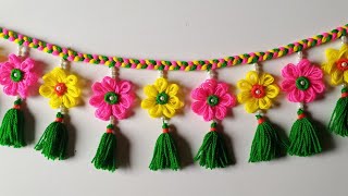 ऊन की तोरणWoolen flower door hangingWool door toran making ideasNew design toranJhallerHow to [upl. by Ravahs614]