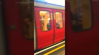 London Underground district line train arriving At Earls Court station [upl. by Enilekaj]