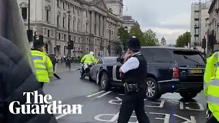 Boris Johnsons car struck from behind as protester runs in front of convoy [upl. by Leesen]