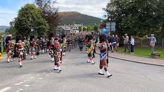 Massed Pipes and Drums marching to the 2023 Braemar Gathering Highland Games in Scotland [upl. by Swain]