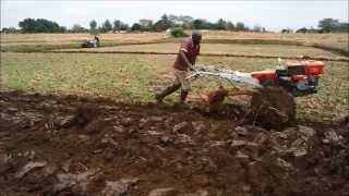 Power tiller operation by plough and ratavator at irrigation farm [upl. by Reldnahc]