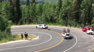 Cyclist racing downhill crashes into moving car [upl. by Brosy]