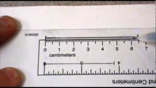 Measuring to the nearest cm and mm [upl. by Anoval]