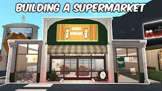 BUILDING A SUPERMARKET IN MY BLOXBURG TOWN [upl. by Enitselec]