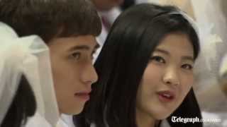 Thousands of Moonies marry in mass wedding [upl. by Aikmat402]