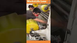 Worker uses machinery to produce Sellotape tape rolls with precise cutting and winding processes [upl. by Aerdnek]