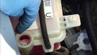 How to check and add coolant fluid Toyota Yaris Years 20062011 [upl. by Oicapot694]