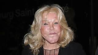 Jocelyn Wildenstein 82 looks youthful in a plunging mesh top as she shares a kiss with her fiancé [upl. by Leohcin]