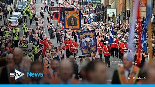 ‘Racist and sectarian’ singing at Orange marches condemned by police [upl. by Ardnasal]