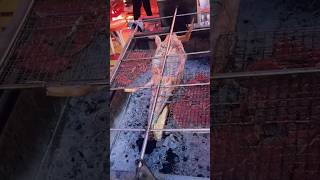 The process of grilling crocodile meat on a rotating grillshorts tools [upl. by Adlesirhc]