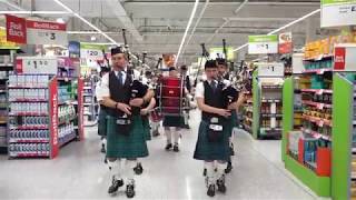 Newtonhill Pipe Band surprise shoppers in Asda Portlethen with performances in supermarket [upl. by Francisco]