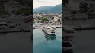 Vertical video Igoumenitsa Greece Lefkimmi Lines ferry unloads in the port at the pier Aerial [upl. by Amby879]