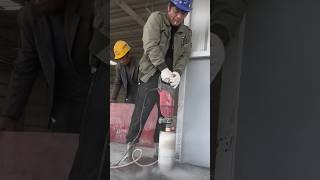 The process of drilling a large diameter hole in a concrete floor [upl. by Euqinu902]