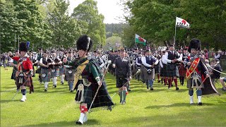 Massed Pipes and Drums morning parade during the 2022 Gordon Castle Highland Games in Scotland [upl. by Lunetta304]