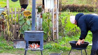 Happy family builds a house far from civilization Cooking Uzbek pilaf on an outdoor stove [upl. by Gare]