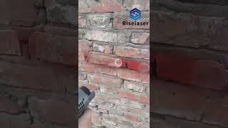 Laser cleaning machine removes paint graffiti from the wall [upl. by Ahsilyt862]